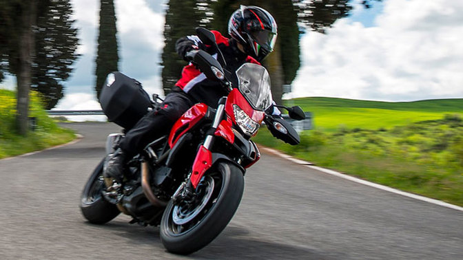 Ducati Hyperstrada Slant Rear View With Rider Full Image